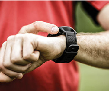 Man looking at his smart watch.