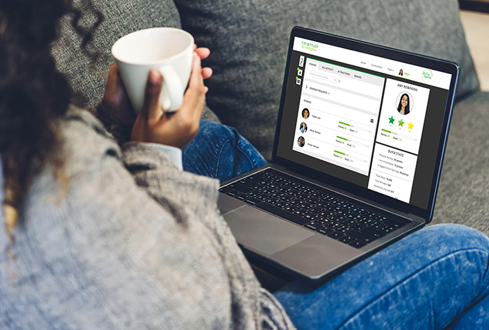 Remote worker looking at a custom wellness challenge on a laptop