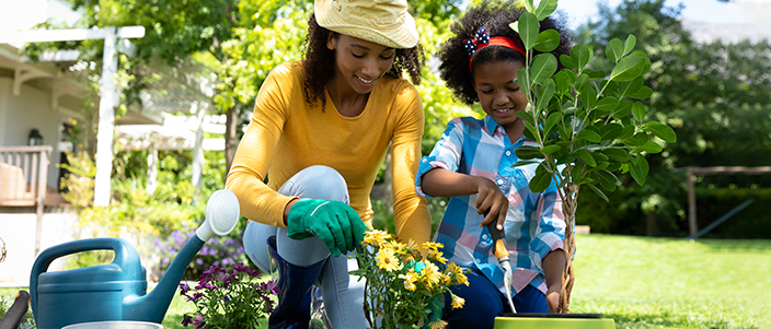 mother and daughter planing flowers