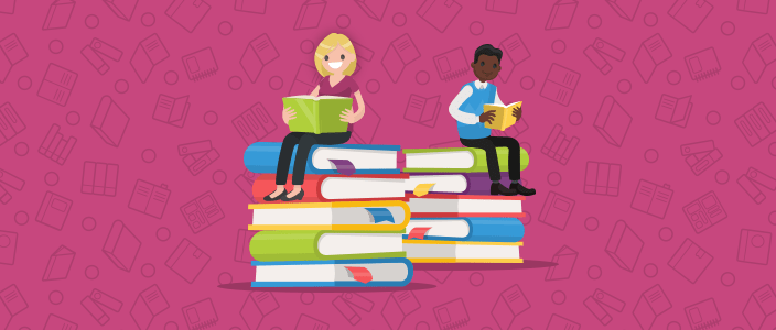 Two adults sitting atop stacked books, reading