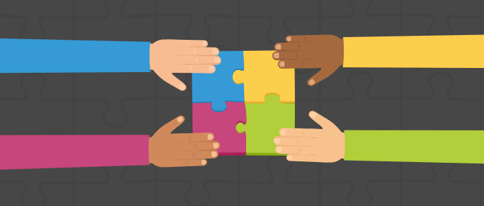 A group of people collaborating to put together a puzzle