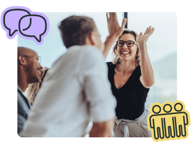 Co-workers giving each other a high-five