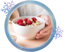 A bowl of oatmeal with fruit.