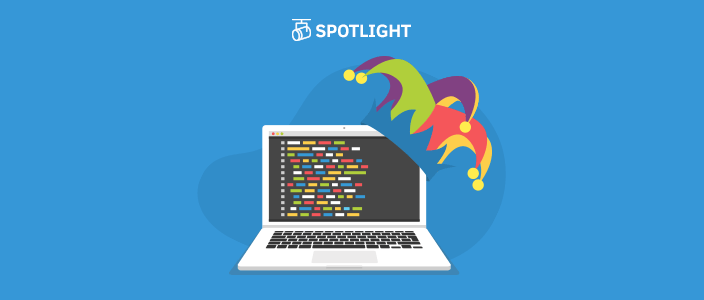 a developers laptop wearing a joker's hat